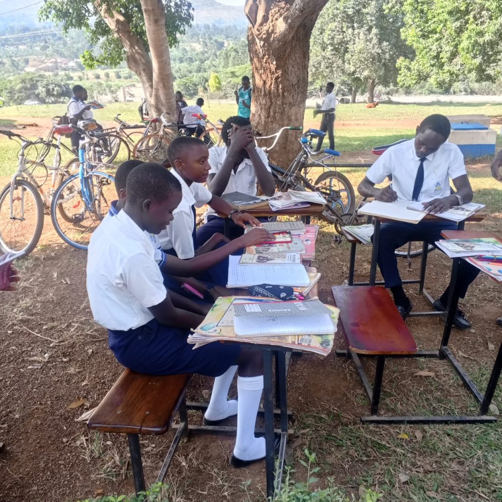 Nakwaya Secondary School learners studying together outdoors